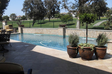 Inspiration for a mid-sized timeless backyard tile and rectangular lap pool remodel in Los Angeles