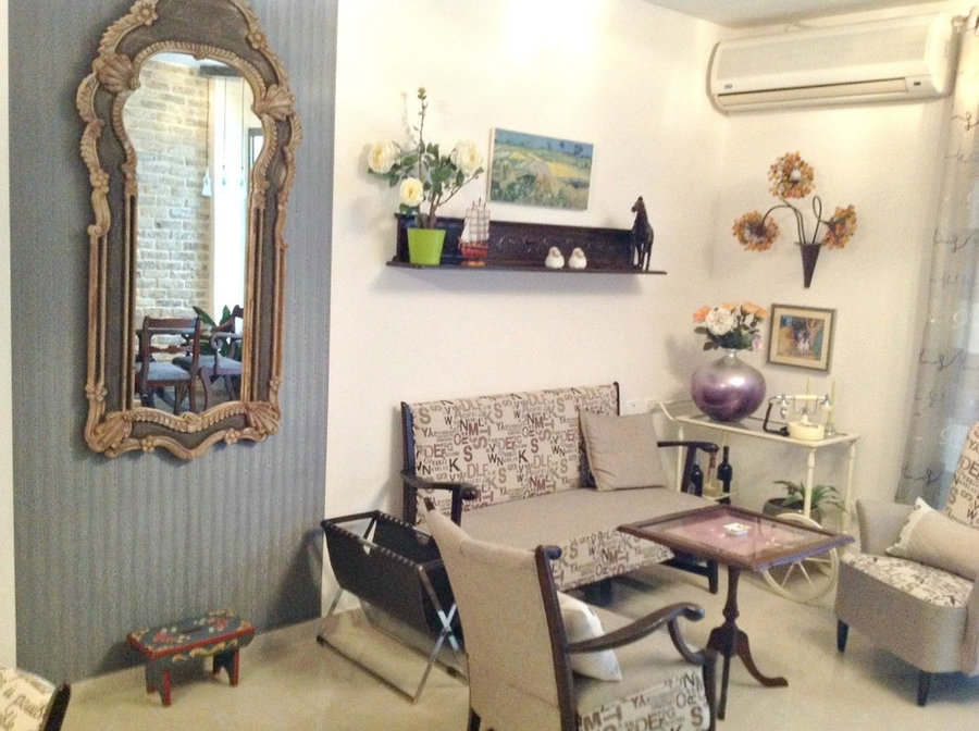 formal sitting area with huge mirror