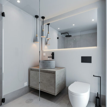 Laranjeiras bathroom with grey vanity, shower and black fittings