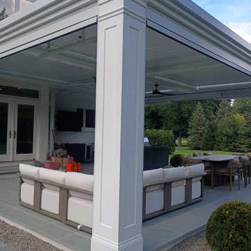 Custom column wrap trim on a motorized louvered pergola