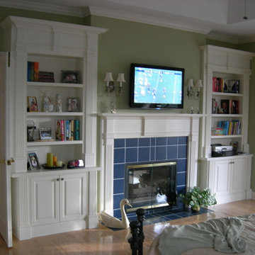 Built-in bookcase units flanking fireplace