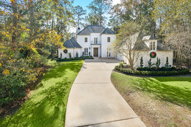 Transitional white three-story brick exterior home photo in New Orleans