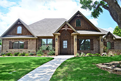 Inspiration for a timeless two-story mixed siding exterior home remodel in Austin