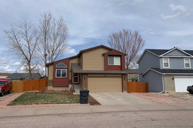 Mid-sized traditional beige two-story mixed siding and board and batten exterior home idea in Denver with a shingle roof and a brown roof