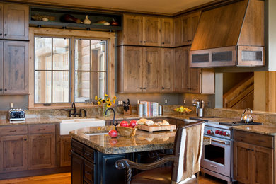 Example of a mid-sized mountain style l-shaped medium tone wood floor kitchen design in Other with a farmhouse sink, recessed-panel cabinets, medium tone wood cabinets and an island