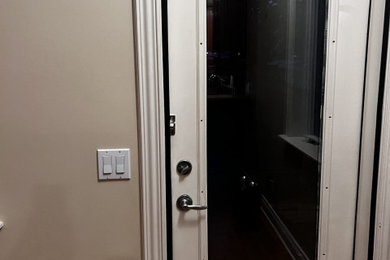 Example of a transitional home design design in Calgary