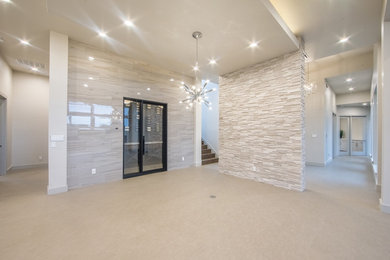 Large trendy open concept limestone floor living room photo in Austin with white walls, a standard fireplace and a tile fireplace