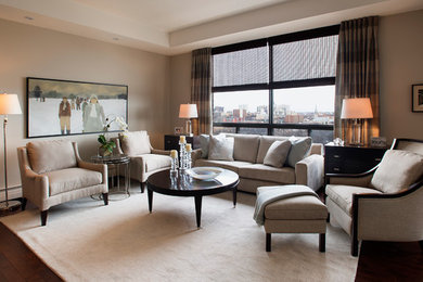 Example of a mid-sized transitional dark wood floor living room design in Toronto with beige walls and a media wall