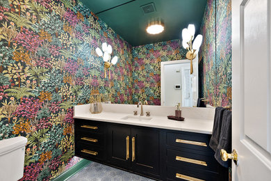 Powder room - small transitional ceramic tile, black floor and wallpaper powder room idea in Detroit with shaker cabinets, black cabinets, a two-piece toilet, multicolored walls, an undermount sink, quartz countertops, white countertops and a floating vanity