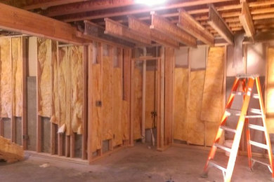 Example of a mid-sized walk-out basement design in Other