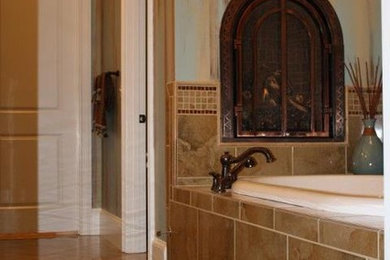 Photo of a mid-sized traditional master bathroom in Atlanta with a drop-in tub, beige tile, ceramic tile, multi-coloured walls, ceramic floors and beige floor.