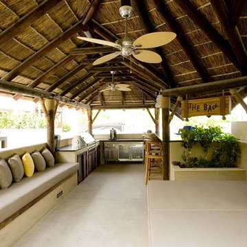 Thatch & timber is the is the focal point of this beautifully landscaped garden