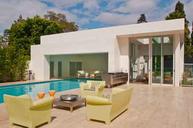 Photo of a large contemporary backyard rectangular pool in Los Angeles with tile.