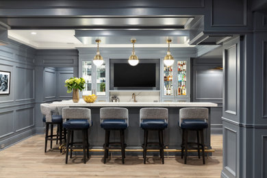 Inspiration for a mid-sized contemporary l-shaped medium tone wood floor wet bar remodel in New York with an undermount sink