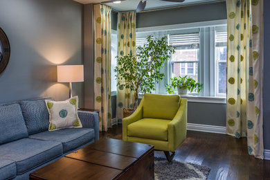 Inspiration for a mid-sized contemporary open concept dark wood floor and brown floor living room remodel in Chicago with gray walls, no tv and no fireplace