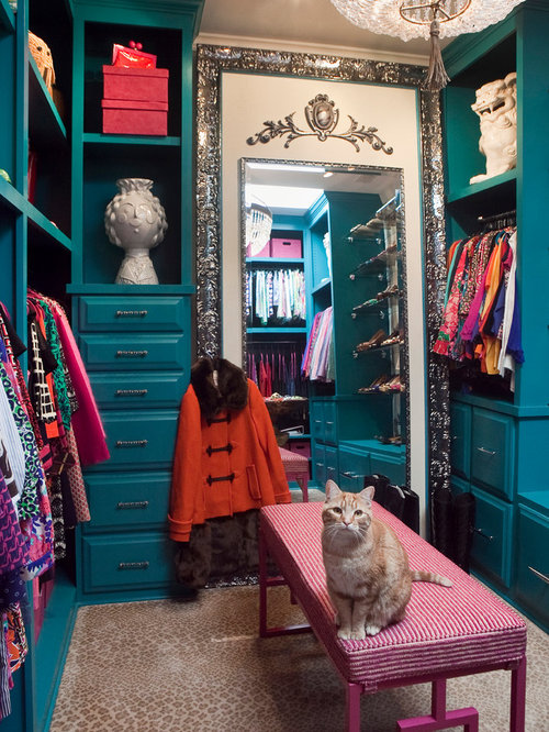 Eclectic Closet Jackson Example of a small eclectic women's dressing room design in Charleston with blue cabinets, raised