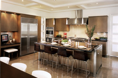 Example of a mid-sized trendy l-shaped dark wood floor enclosed kitchen design in New York with an undermount sink, flat-panel cabinets, dark wood cabinets, quartzite countertops, white backsplash, ceramic backsplash, stainless steel appliances and an island