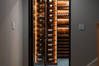 Wine cellar - mid-sized traditional wine cellar idea in Chicago