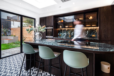 Inspiration for a contemporary kitchen/diner in London with an island.
