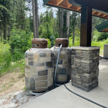 Commissioned Propane Tanks Disguise to match house rocks
