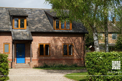This is an example of a medium sized classic house exterior in Cambridgeshire.