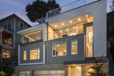 Inspiration for a large modern beige four-story stucco exterior home remodel in San Francisco