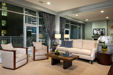 Mid-sized eclectic medium tone wood floor living room photo in Other with blue walls, a standard fireplace and a wall-mounted tv
