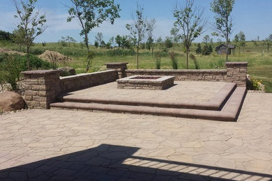 Photo of a traditional full sun backyard stone landscaping in Other.