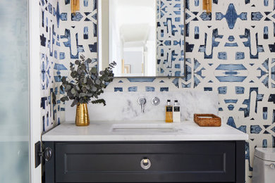 Example of a transitional powder room design in Other