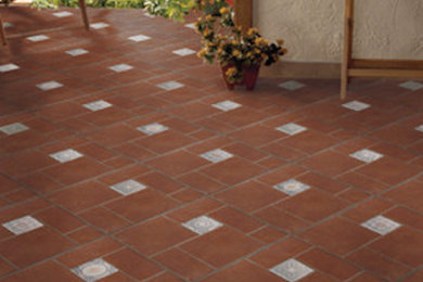 This is an example of a backyard patio in Tampa with tile.