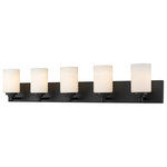 Z-Lite - Soledad Five Light Vanity, Matte Black - Let your bathroom or hallway bask in soft warm light. This contemporary five-light wall sconce has a sophisticated streamlined look and extends from a long mirrored plate for a chic contrast. From the sconce's cylindrical white etched glass shades to its matte black finish this fixture stylishly upgrades your space.