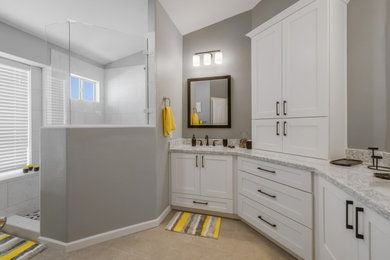 Large minimalist master white tile and porcelain tile porcelain tile, brown floor and double-sink bathroom photo in Phoenix with shaker cabinets, white cabinets, gray walls, an undermount sink, quartz countertops, gray countertops, a niche and a built-in vanity
