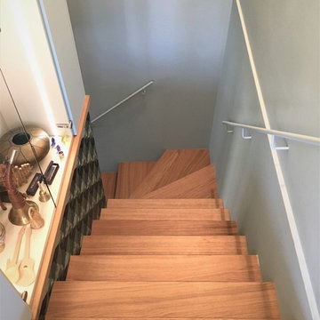 La scala di Escher collega i due piani di un Attico a Milano.