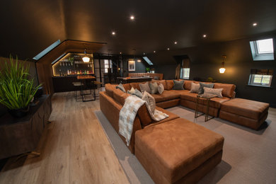 Photo of a large contemporary mezzanine games room in Other with a game room, green walls, light hardwood flooring, no fireplace, a wall mounted tv and beige floors.