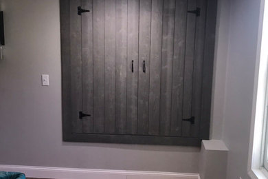 Example of a mid-sized trendy single-wall beige floor home bar design in Providence