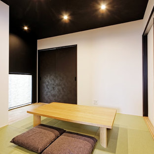 Design ideas for a modern home office and library in Other with white walls, tatami flooring, a freestanding desk and green floors.