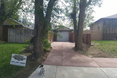 Photo of an eclectic full sun backyard driveway in Denver.