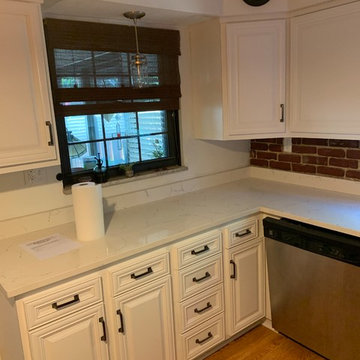 refaced cabinets in white with quartz counters