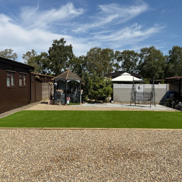 Wide Shingle Area In Front of a Park Home Lawn