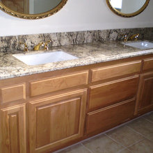 Gold, granite, maple cabinet