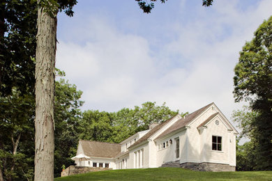 Example of a mountain style wood exterior home design in Bridgeport