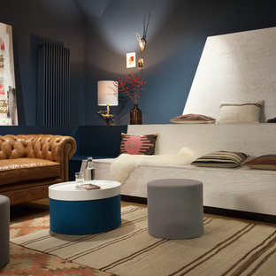 Example of an eclectic home theater design in Berlin with blue walls