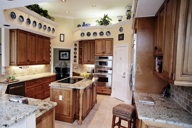 Example of a mid-sized classic eat-in kitchen design in Jacksonville with raised-panel cabinets, medium tone wood cabinets, granite countertops, an island and white countertops