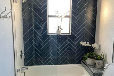 Bathroom - mid-sized modern kids' blue tile and glass tile cement tile floor and white floor bathroom idea in Austin