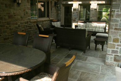 This is an example of a large backyard stone landscaping in Toronto.