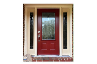 This is an example of a traditional front door in DC Metro with a single front door and a red front door.