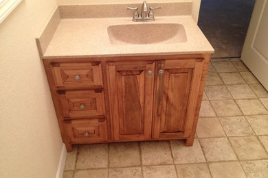 This is an example of a 3/4 bathroom in Nashville with laminate benchtops, beige tile and ceramic tile.