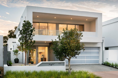 Photo of a contemporary two-storey white house exterior in Perth with painted brick siding, a flat roof, a metal roof and a grey roof.