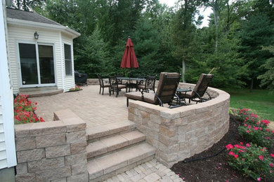 Patio - mid-sized contemporary backyard concrete paver patio idea in Boston