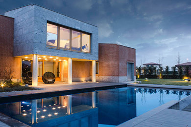Ispirazione per la facciata di una casa grande contemporanea a due piani con rivestimenti misti e tetto piano